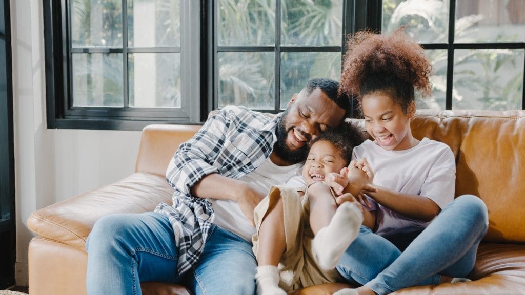 Happy family in their new lease to own home