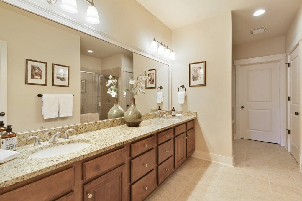 Elegant bathroom with natural tones and soft lighting, a welcoming space for those seeking rent to own Raleigh opportunities in a changing workforce landscape where remote work is declining.