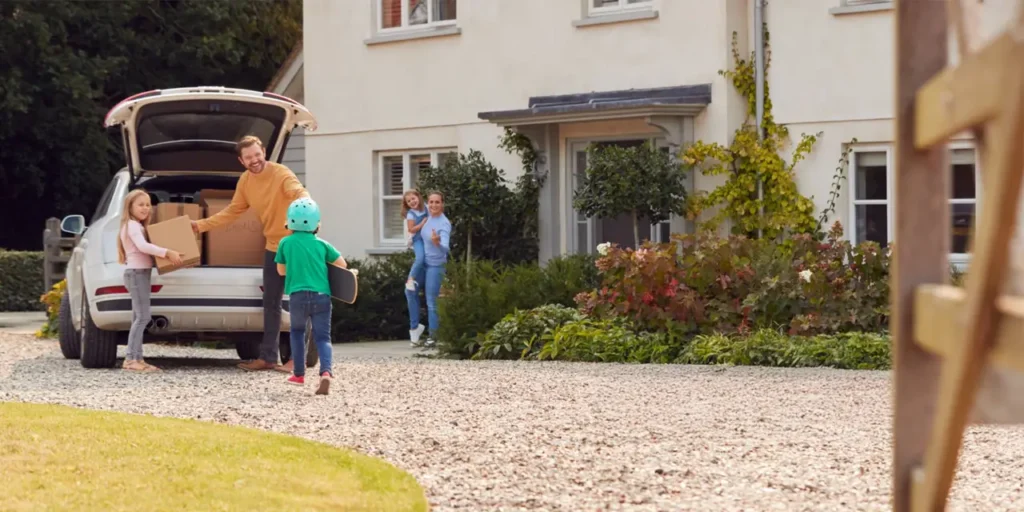 Happy diverse family moving into a lease to own home in Raleigh, North Carolina, building toward affordable homeownership.